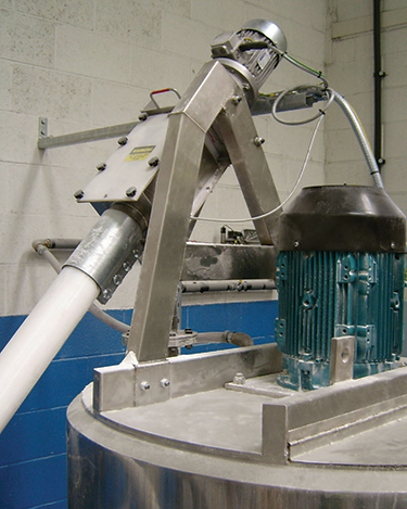 Schüttgut-Handling-System beseitigt Staub, reduziert Materialverschwendung und rationalisiert die Produktion von Wellpappe